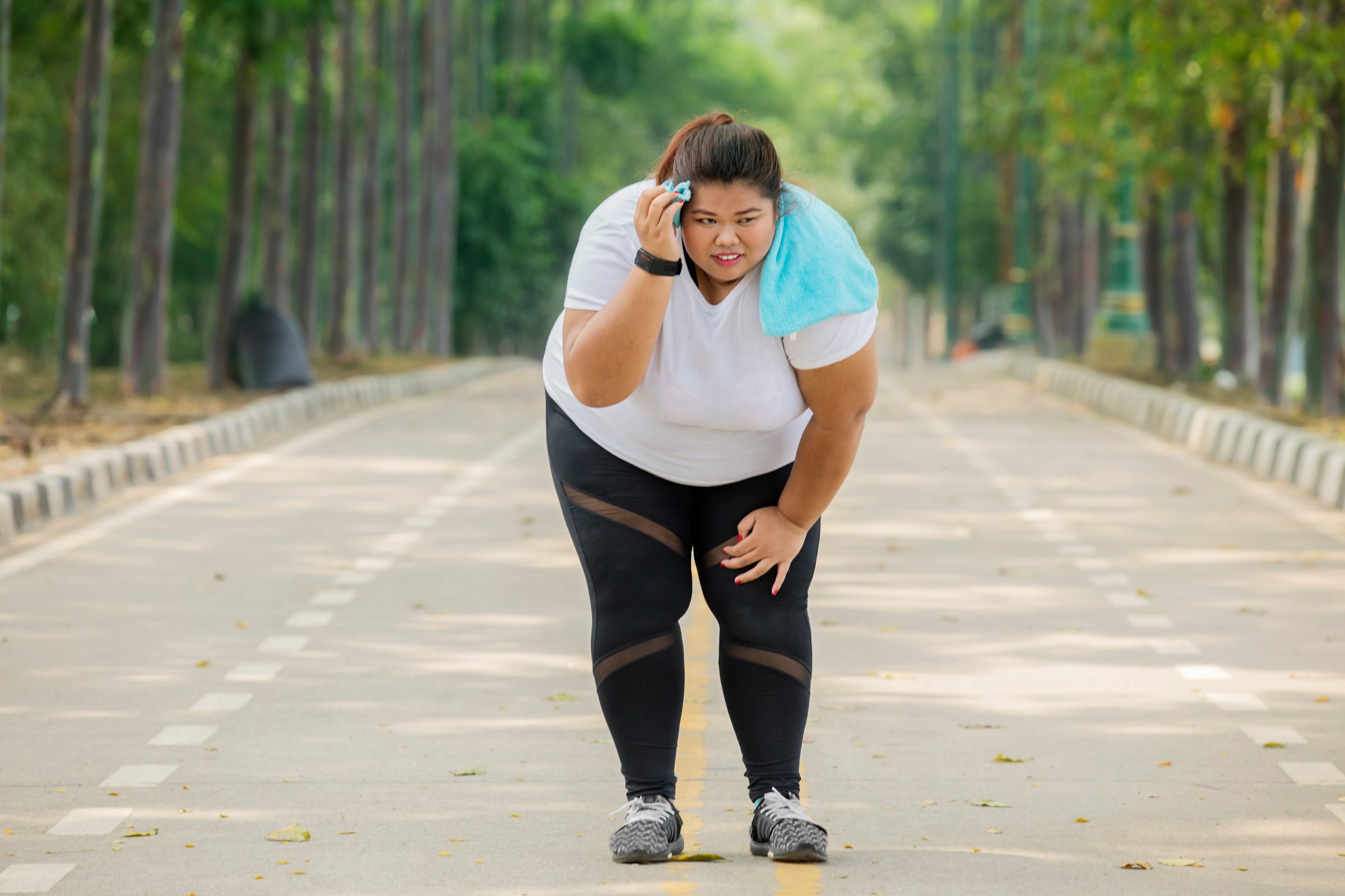 Obese Woman Looks Tired after Running